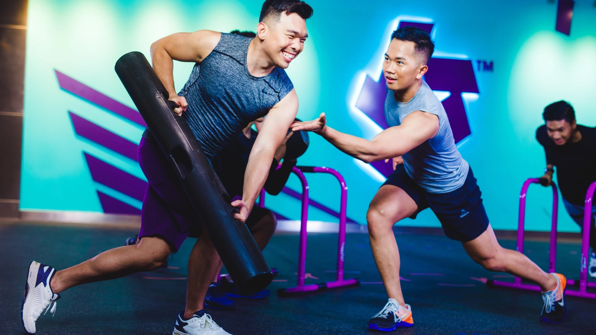 A Starmaker Trainer guiding a Celebrity Fitness member